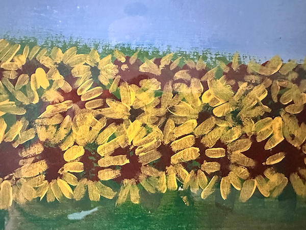 A group of yellow flowers  AI-generated content may be incorrect.