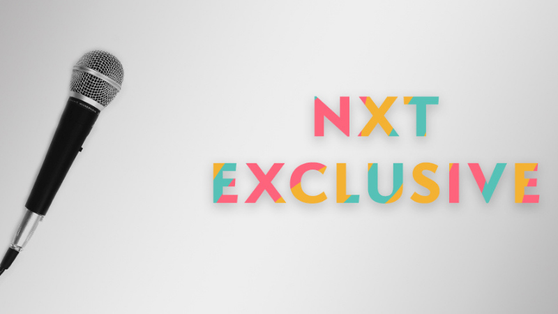Nxt-Exclusive-Banner Microphone next to NXT Exclusive